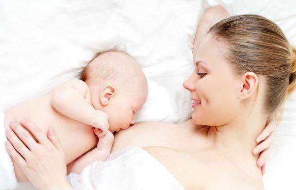 Sophie shows mom how to find comforting feeding position while resting at night.