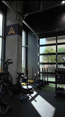 Corner of the gym containing free weights.