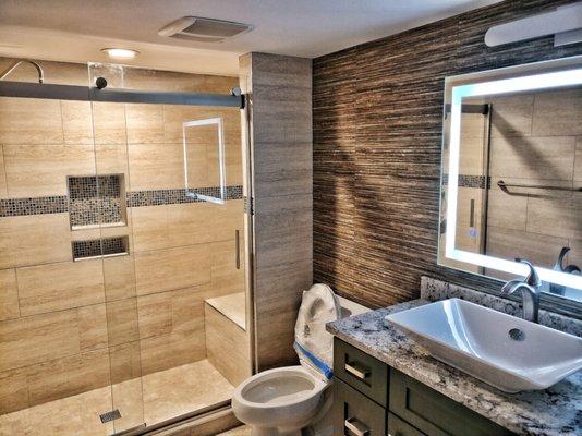 tiles from spain, tub replace with walk-in shower, bluetooth music and LED mirrors.