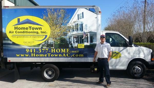 Cameron posing for a photo with the truck