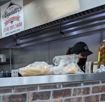 Manager refuses to cover her nose when making sandwiches.