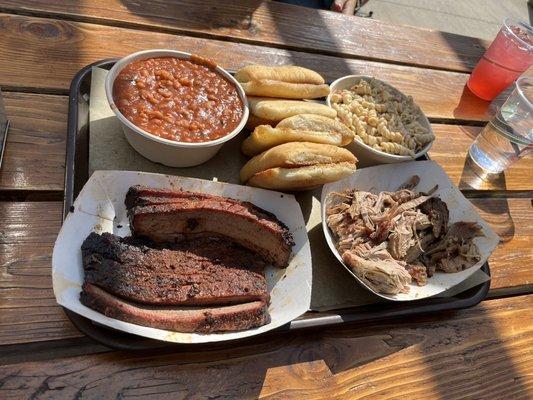 1 lb each of brisket and pork, pasta salad, beans, and ciabatta rolls.