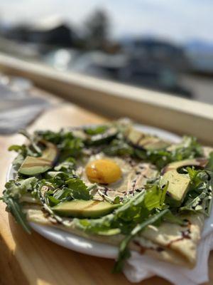 Savory truffle crepe with Parma ham, arugula, truffle oil, avocado and egg.