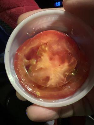 Tomatoes in a cup that she gave me instead of remaking the sandwich