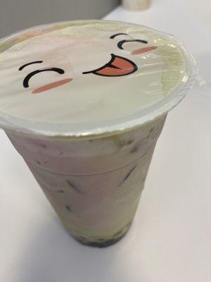 Strawberry and matcha tea with tapioca pearls.