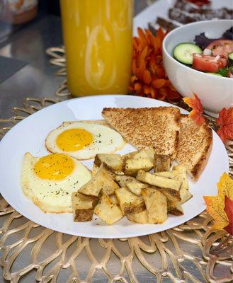 Sunny side up eggs w/ home fries and toast