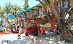 The shaded sandbox beneath the big tree near the main entrance of St. Mark's. A happy place!