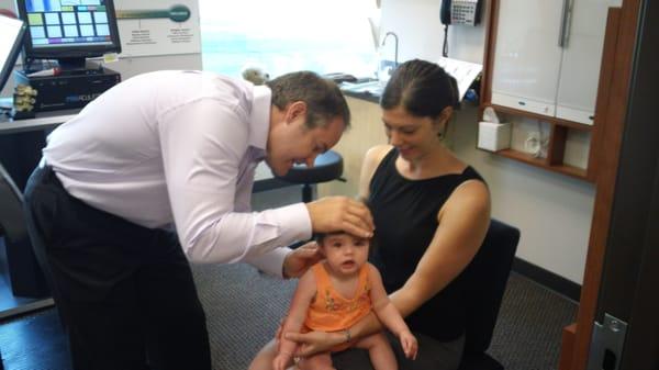 Dr Kambeitz examining a toddler patient