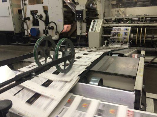 Signatures being delivered from one of our web offset presses.