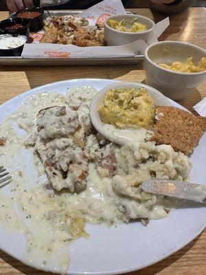 Chick fried steak with garlic mash and broccoli and rice casserole.