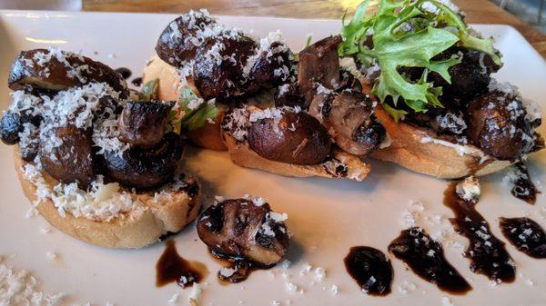 Marinated mushrooms roasted in butter, thyme, with whipped shallot butter & topped with arugula & parmesan on crostini