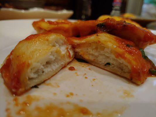 Plain cheese ravioli with vodka sauce and fresh basil.