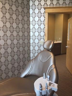 Private treatment room, with heated, massaging dental chairs.