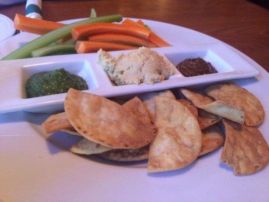 Hummus plate with pesto and red pepper dip