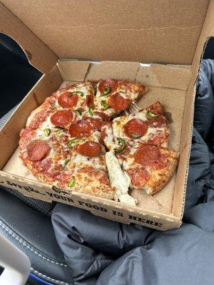 Cheese, pepperoni and jalapeño pizza.