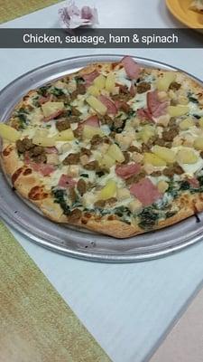 Personal pizza order; chicken, spinach, pineapple, ham and sausage