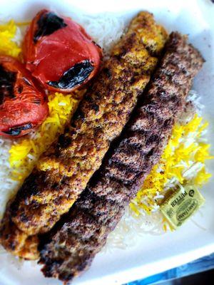 Beef and Chicken Koobideh Combo on a bed of rice and grilled tomatoes