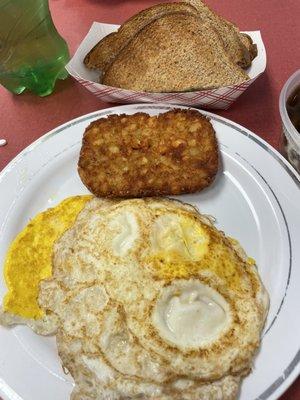 Two eggs, hash brown and toast