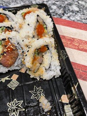 You could have rolled this sushi a little better. Use bigger pieces of fish and don't cut it thin. Rice only on the outside.