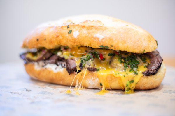 Chimichurri steak and Tillamook cheddar sandwich, served hot and melty