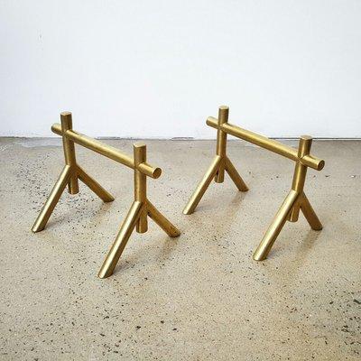 Mid-century modern solid brass fire dogs by Christopher Dresser.