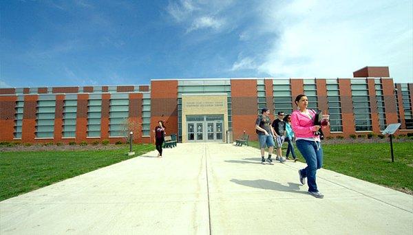 Students leaving Moraine Valley's Southwest Education Center on a sunny day.