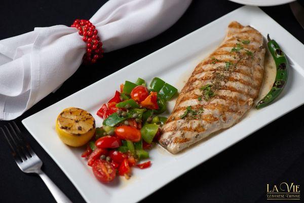 Snapper Fillet with Sauteed Vegetables and caramelized Garlic sauce