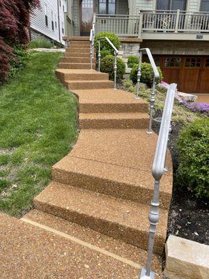 Exposed aggregate steps and porch sealed with 2 coats, color added and joints caulked.