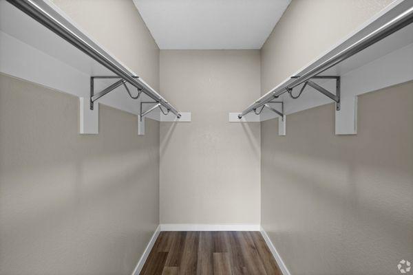 Step into luxury with this spacious and stylish closet.