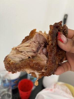 Fried chicken thigh that's red inside it glad I checked I was feeding the family with this food.