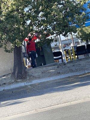 Carwash employees enjoying a beer at work, just keep in mind they like to drive your car recklessly through our shopping center.