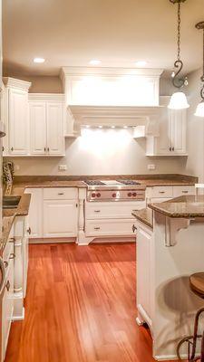 We refinished the kitchen cabinets that were previously painted and had a glaze on there to appear antique looking