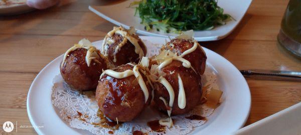 Takoyaki (たこ焼き or 蛸焼) is a ball-shaped Japanese snack filled with octopus.