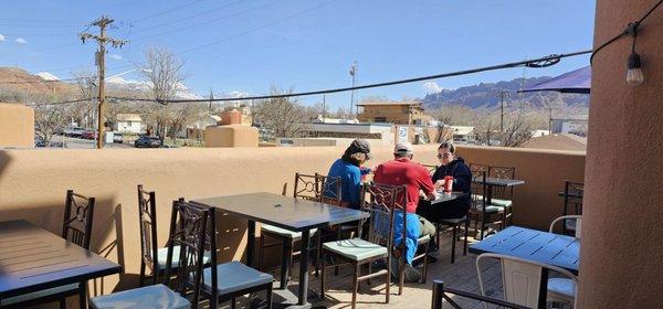 2nd story outdoor seating, choice of sun or shade, with some views in the distance