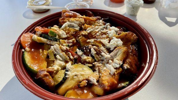 Chicken bowl with garlic & pomegranate sauces.