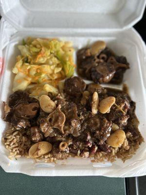 Oxtail with rice and beans and cabbage