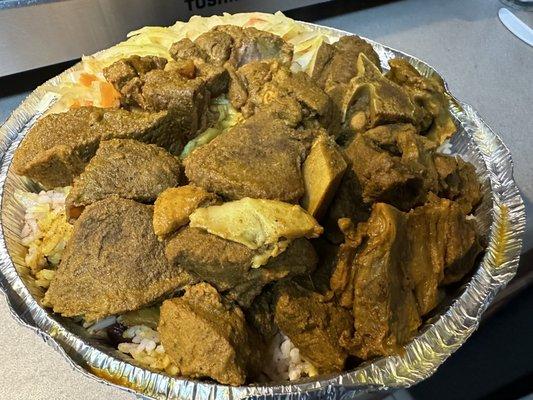 Curry Goat, rice, beans and veggies (cabbage). It was also advertised with plantains but I didn't get them, not sure if that was an error)