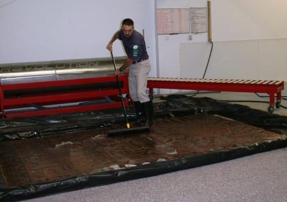 Immersion-Wash process for a beautiful Persian rug to dissolve soil and stains.