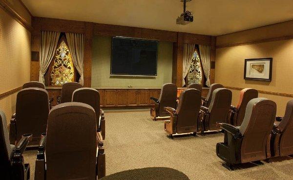 Some assisted living facilities have a theater room.