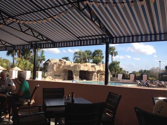 View from eating patio onto pool and hot tub area.