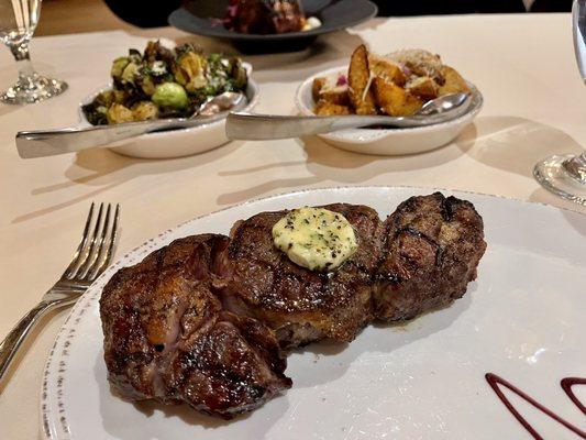 Steak with Yukon gold potatoes and Brussel sprouts in the background