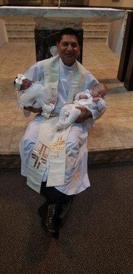 Father Wayne, picture after christening two of the babies, the ceremony as always was outstanding