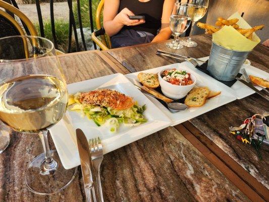 The happy hour menu is fantastic. The fries are fluffy and legit, the salmon on a bed of leeks is delicious