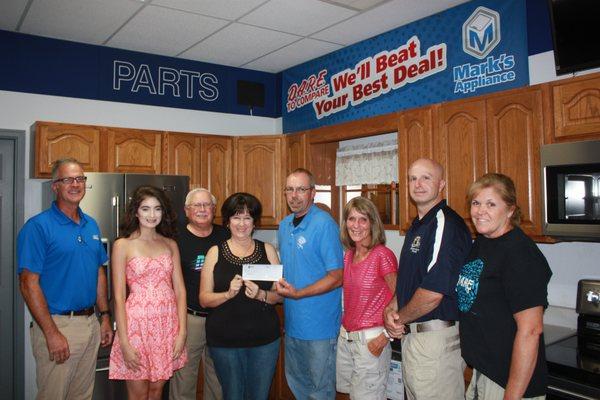 Presenting a Sponsorship check for the 7th Annual Jerseyville Police Department D.A.R.E. Car, Truck & Motorcycle Show