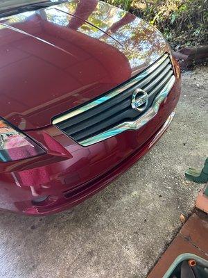 Entire front bumper replaced and painted. Bottom of silver grill repaired