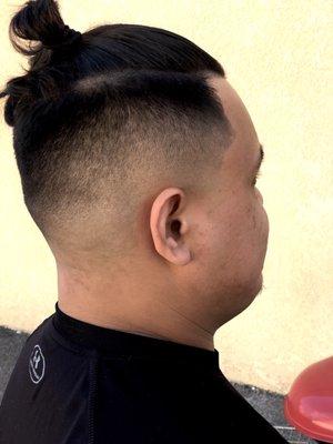 Man bun with mid fade