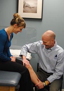 Michael Vacon, PT working with a patient at Blue Hills Sports and Spine Rehabilitation's Braintree office