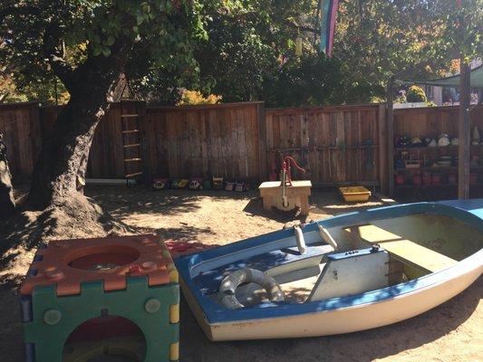 Front yard/hilltop boat and water pump.