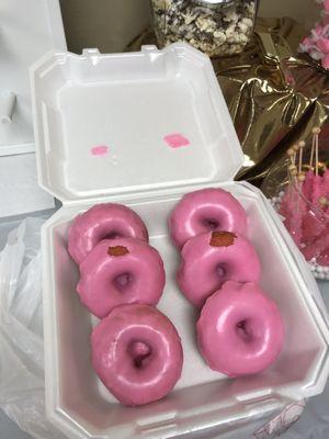 All the donuts lost frosting as they leaned on each other and were put into the box hot