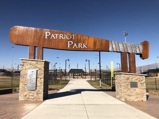 The huge baseball bat welcoming you to Patriot Park.